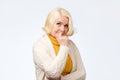 Blonde older woman smiling and looking at camera Royalty Free Stock Photo