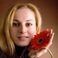 Blonde with a red flower Royalty Free Stock Photo
