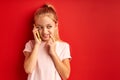 Blonde schoolgirl talk on phone, portrait Royalty Free Stock Photo