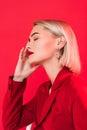 blonde sensual girl posing in red jacket Royalty Free Stock Photo