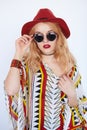 Blonde sensual woman in cow-girl red hat and sunglasses Royalty Free Stock Photo