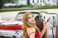 Blonde sensual young woman near car outdoor. Seductive woman face. Sensual young woman posing with sexy body. Beautiful Royalty Free Stock Photo