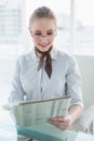 Blonde smiling businesswoman reading newspaper Royalty Free Stock Photo