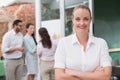 Blonde smiling businesswoman standing with arms crossed Royalty Free Stock Photo