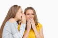 Blonde student whispering to her voiceless friend Royalty Free Stock Photo