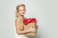 Blonde teen with gift. Happy birthday, girl with big birthday present. Valentine.