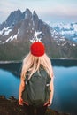 Blonde traveler woman with backpack hiking traveling outdoor in Norway active healthy lifestyle girl enjoying mountains Royalty Free Stock Photo