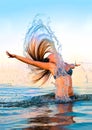 Blonde in the water waving hair Royalty Free Stock Photo