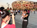 Blonde Western Baby Being Photographed by Chinese Girls