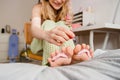 Blonde white girl laughing while applying nail polish Royalty Free Stock Photo