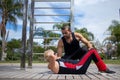 Blonde lady exercising with her personal trainer