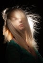 Blonde, whose hair is blown by a wind Royalty Free Stock Photo