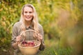 Blonde winegrower holding a red grapes basket Royalty Free Stock Photo