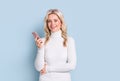 Blonde woman adult attractive beautiful smiling portrait with cellphone, mobile, cauasian and scandinavian girl on blue background Royalty Free Stock Photo