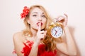 Blonde woman with alarm-clock