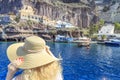 Blonde woman arriving port of Fira in Santorini, Greece Royalty Free Stock Photo