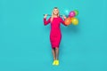 Blonde woman with balloons on blue Royalty Free Stock Photo