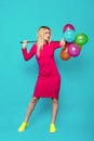 Blonde woman with balloons on blue Royalty Free Stock Photo