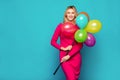 Blonde woman with balloons on blue Royalty Free Stock Photo