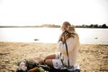 Blonde Woman On The Beach With Kitten Royalty Free Stock Photo