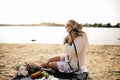 Blonde Woman On The Beach With Kitten Royalty Free Stock Photo