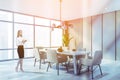 Blonde woman in beige dining room Royalty Free Stock Photo