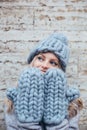 Blonde woman in blue knitted hat