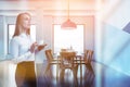 Blonde woman in blue and white dining room Royalty Free Stock Photo