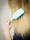 Blonde woman brushing hair back view Royalty Free Stock Photo