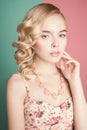 Blonde woman with color makup on colorful background