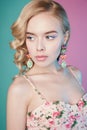 Blonde woman with color makup on colorful background