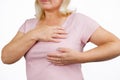 A blonde woman complains of chest pain. Cancer breast concept