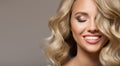 Blonde woman with curly beautiful hair smiling Royalty Free Stock Photo