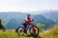 Blonde woman cycling in the Mont Blanc