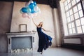 Blonde woman dance with balloons