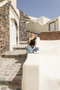 blonde woman exploring santorini greece Royalty Free Stock Photo