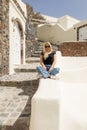 blonde woman exploring santorini greece Royalty Free Stock Photo