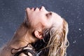 Blonde woman with falling water droplets Royalty Free Stock Photo