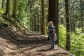 A blonde woman goes trekking inside the Acquerino Cantagallo nature reserve, between the provinces of Pistoia and Prato, Italy