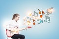 Blonde woman with a guitar, notes blule Royalty Free Stock Photo