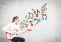 Blonde woman with a guitar, notes Royalty Free Stock Photo