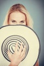 Blonde woman hiding behind sun hat