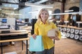 Blonde woman holding boxes and paper packege Royalty Free Stock Photo