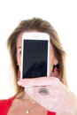 Blonde woman holding out presenting cellphone in her hand with black blank empty screen Royalty Free Stock Photo