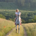 Blonde woman and horse