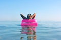 Blonde woman with inflatable raft Royalty Free Stock Photo