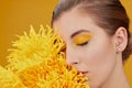 Blonde woman with yellow flowers Royalty Free Stock Photo