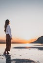 Blonde woman in Pamukkale enjoying the awesome sunset in the travertines Royalty Free Stock Photo