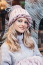 Blonde woman in pink knitted hat