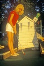 Blonde woman playing miniature golf, Fayetteville, AR Royalty Free Stock Photo